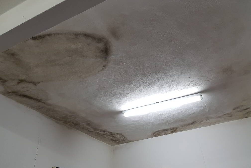 Ceiling leaks in a Singapore HDB flat causing water stains and peeling paint